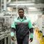 James Okonkwo, Implementation Manager, walking through a modern plant